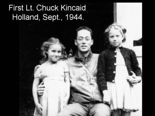 soldier chuck kincaid in the netherlands with two Dutch children, likely 1944