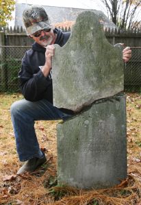Fort Edward historian (and friend) Paul MCarty shows a damaged gravestone for Mintus Northup, father of Solomon Northup, who is buried in Fort Edward, on Monday, Oct. 14, 2013. The Northups lived in the Fort Edward area for many years. A new feature film portrays the freed slave's story from free man to slave and back to a free man. (Derek Pruitt - dpruitt@poststar.com)