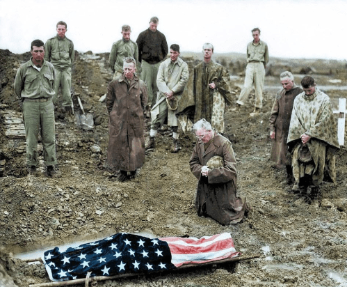 Colonel (later Brigadier General) Francis I. Fenton buries his son Michael on Okinawa, May, 1945.